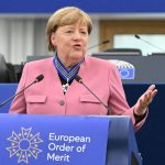 Europe’s Ironies: Merkel and Zelensky Cement Legacies with Grand Order Europe’s Ironies: Merkel and Zelensky Cement Legacies with Grand Order