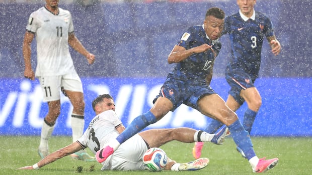 Mbappe’s Double Propels France to World Cup Knockout Stage, Weather Delay Notwithstanding Mbappe’s Double Propels France to World Cup Knockout Stage, Weather Delay Notwithstanding