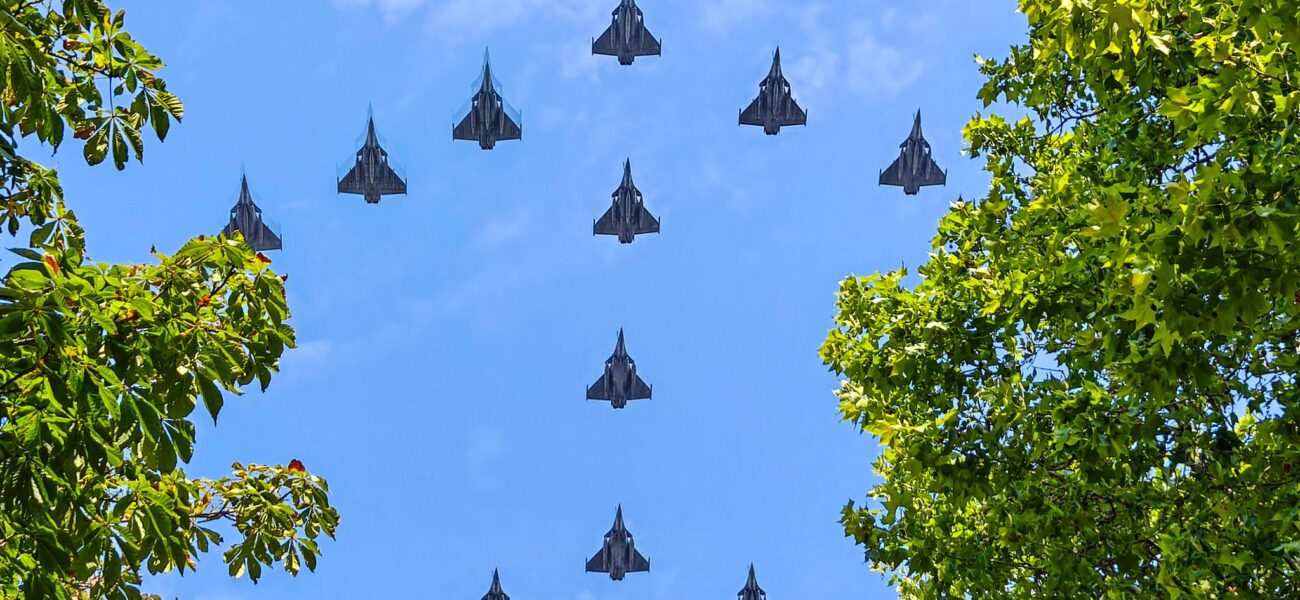 Bastille Day’s Glitzy Pomp: Macron’s Ukrainian Gambit Under a Stormy European Sky