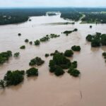 US Faces Simultaneous Floods, Heatwaves, and Wildfire Smoke Amid Aid Cuts