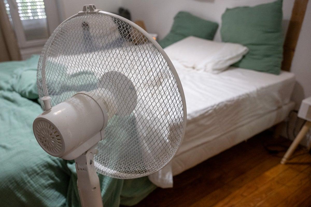 Expert Weighs Pros and Cons of Sleeping with a Fan On Expert Weighs Pros and Cons of Sleeping with a Fan On