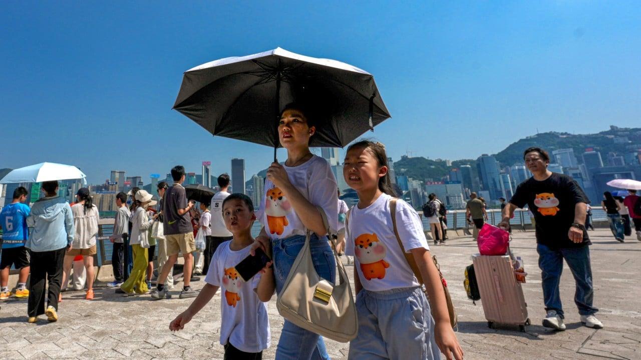 Hong Kong Sets New Record for Hottest Day Amid Typhoon Dolphin Hong Kong Sets New Record for Hottest Day Amid Typhoon Dolphin