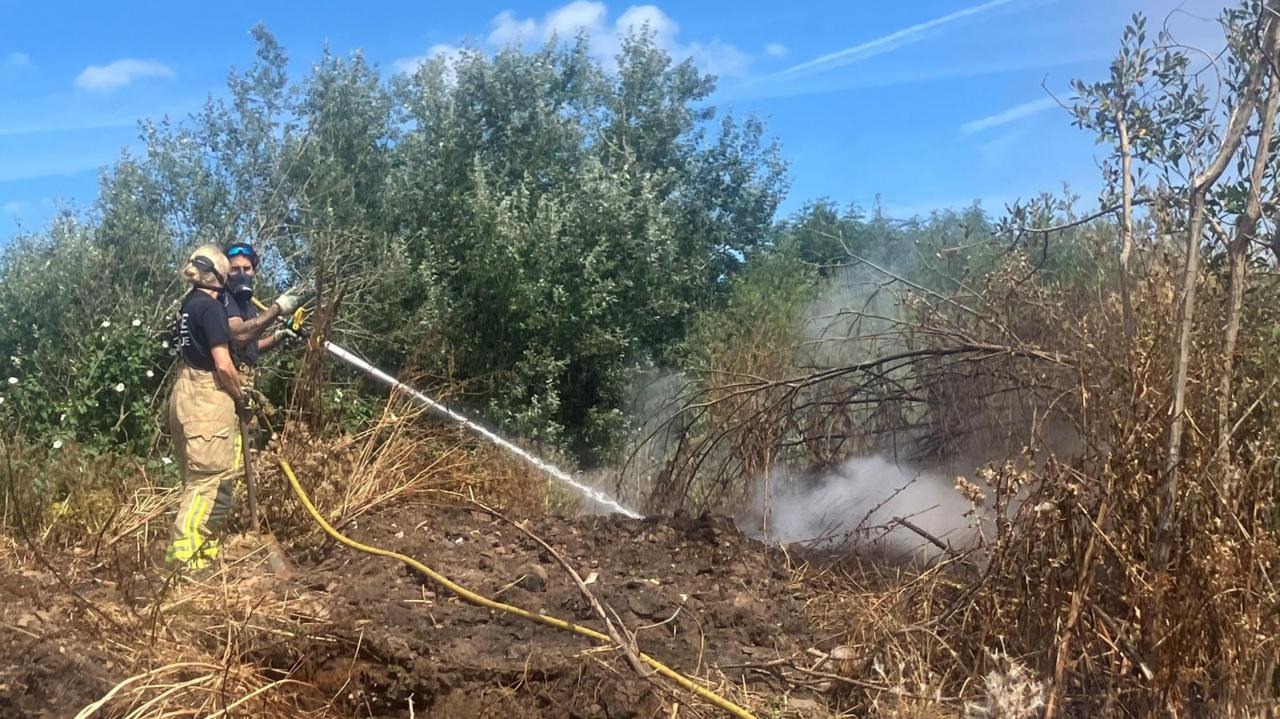 Firefighters Battle Blaze at Suspected Illegal Waste Dump in Trafford Firefighters Battle Blaze at Suspected Illegal Waste Dump in Trafford