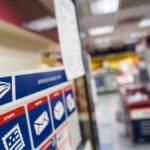 Postal Service Halts Key System in Response to Trump’s Mail Voting Plan