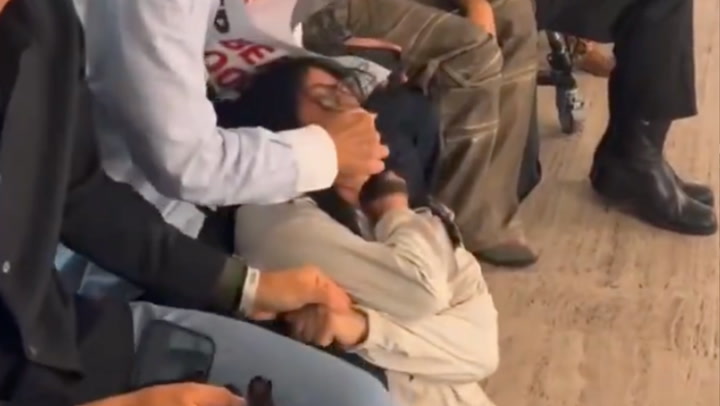 Fashion CEO Confronts Animal Rights Protester at NYFW Show Fashion CEO Confronts Animal Rights Protester at NYFW Show
