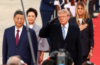 Trump Draws Criticism for Winter Gear at Xi Jinping’s Airport Welcome