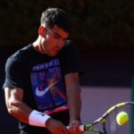 Alcaraz Overcomes Serve Struggles to Defeat Michelsen in Tokyo