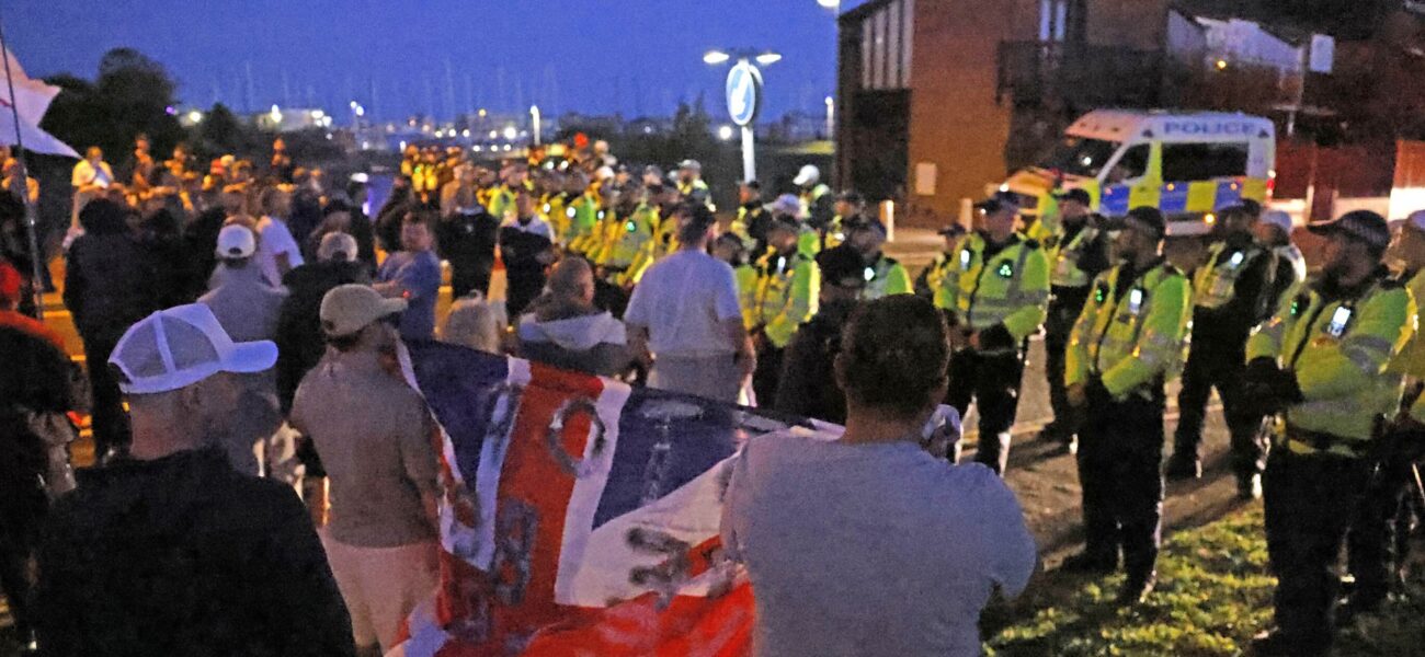 Anti-Migrant Demonstrators Assemble in Hampshire as Migrant Boat Reaches UK Coast